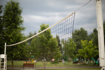 Fototapeta premium Beach volleyball. Net on the court. Playground for ball games.