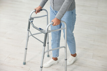Senior woman with walking frame at home, closeup