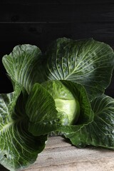 Fototapeta premium One ripe head of cabbage on wooden table