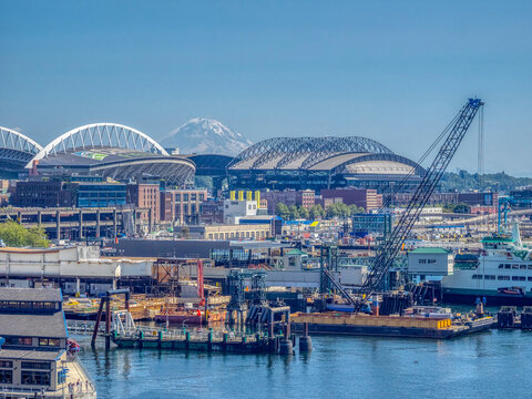 WA, Seattle, Waterfront with Mount Rainier and baseball and football sports stadiums (Editorial Use Only)
