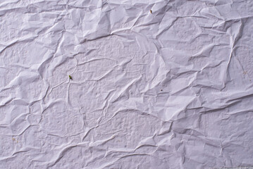 white crumpled and creased glued wrinkled paper poster texture background