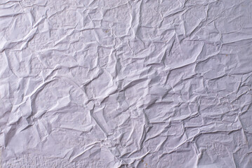 white crumpled and creased glued wrinkled paper poster texture background