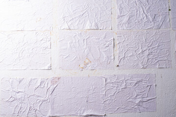 white crumpled and creased glued wrinkled paper poster texture background