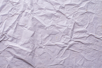 white crumpled and creased glued wrinkled paper poster texture background