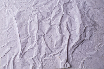 white crumpled and creased glued wrinkled paper poster texture background