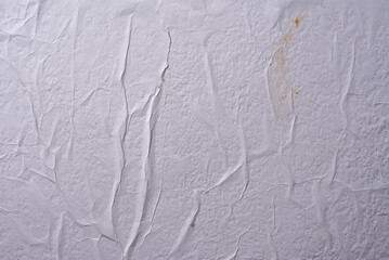 white crumpled and creased glued wrinkled paper poster texture background