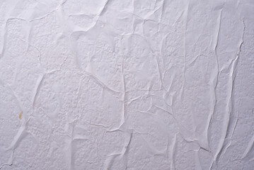 white crumpled and creased glued wrinkled paper poster texture background