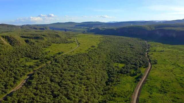 Cinematic stunning scenery and tranquil beauty of Hell's Gate National Park is filled with lush greenery, winding roads and breathtaking views in a peaceful natural setting. Drone footage from Kenya
