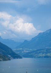 Obraz premium Alpine mountains and like in Switzerland. Hiking in the Swiss Alps mountains during summer, hiking trail in Switzerland. Lake in the Swiss Alps. Panoramic of the nature and mountains of Switzerland.