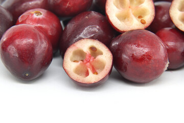 Fresh Red Cranberries With Cross-Sectional View On White Background