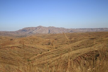 Rolling Hills and Distant Mountains in a Dry, Arid Landscape, Madagascar
