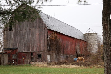 Decaying Red Barn with Attached Structure and Silo