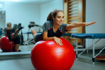 Woman Working on her Strength in a Rehabilitation Gym. Cheerful person working out with proper balance and determination
