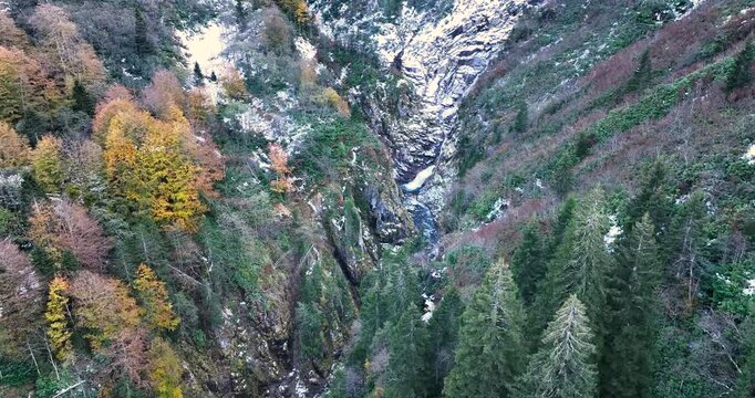 Discover the stunning beauty of autumn and winter, captured from the sky! This high-quality aerial footage of streams and waterfalls showcases the visual splendor of nature in two of the most enchanti