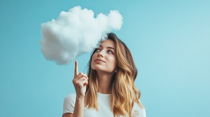 Obraz premium A woman is pointing at a cloud in the sky