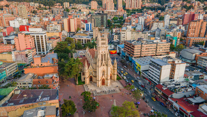 Aerial View of a Classic Church Amidst Modern Buildings in Bogotá, Colombia
