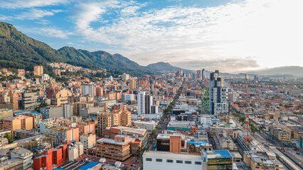 Aerial View of Bogotá, Colombia Showcasing Modern Architecture Against a Scenic Mountain Backdrop