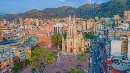 Aerial View of Bogotá, Colombia: Modern Cityscape Featuring Iconic Architecture and Lush Mountains