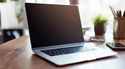 Fototapeta premium Laptop on wooden desk home office setup technology cozy environment close-up view productivity concept