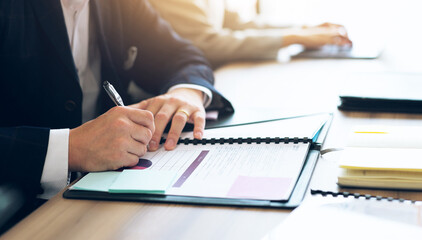 Businessman, hands and sign paper in office for contract renewal, partnership agreement or legal document. Corporate professional, form or pen in Japanese agency for investment, company NDA or policy