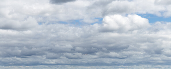 Sky replacement clouds puffy gray and white with blue sky