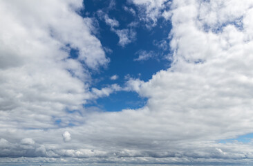 Sky replacement clouds puffy gray and white with blue sky