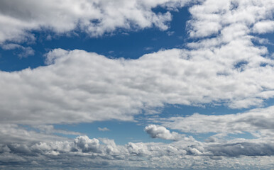 Sky replacement clouds puffy gray and white with blue sky