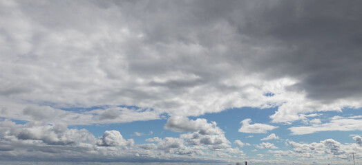 Sky replacement clouds puffy gray and white with blue sky