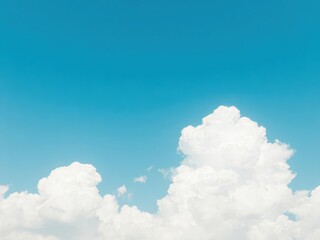 Soft fluffy clouds in a blue sky, creating a textured effect, tranquil