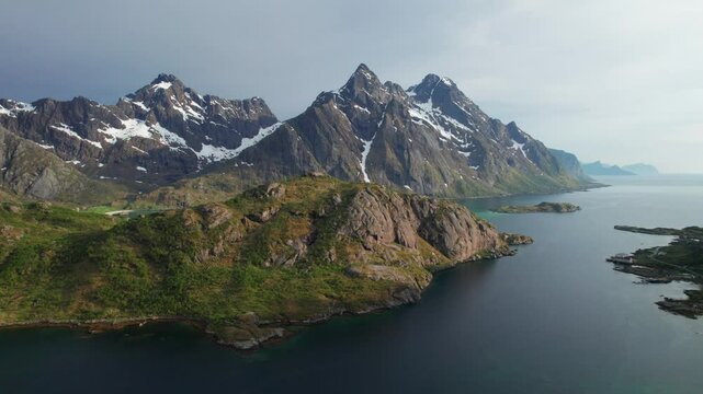 Cinematic Aerial Highlights of Norway&rsquo;s Lofoten Islands: Fjords and Snow-Kissed Peaks in Spring