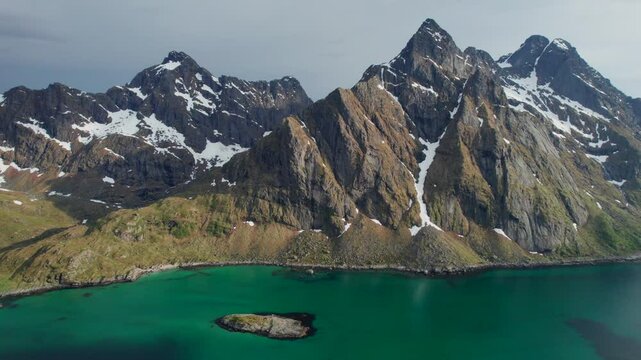 Cinematic Views of the Lofoten Islands: Towering Snow-Capped Peaks and Scenic Fjords in Norway