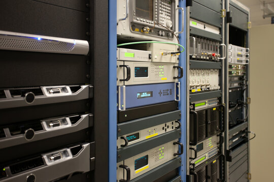 RF timing generator frequency convertor in a data center, rack server, satellite connections equipment indoors at the station, emission analyzers