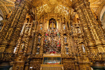 The baroque gilted wood Tree of Jesse altarpiece inside the medieval Church of São Francisco, or...