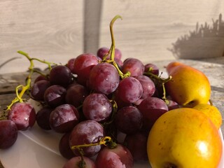 red juicy ripe grapes on a plate