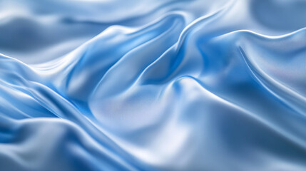 Fototapeta premium Soft blue fabric draped elegantly in gentle waves on a smooth surface