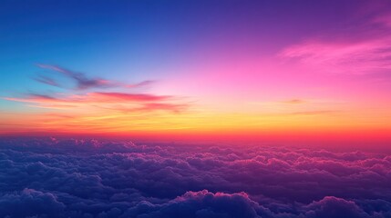 Fototapeta premium Aerial View of a Colorful Sunset Above the Clouds
