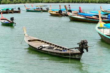 Obraz premium Local fishing boats in southern Thailand. Floating, waiting for the tide to rise so they can go fishing the next day.