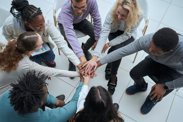 Young businessman and businesswoman workers express cheerful victory showing unity and support