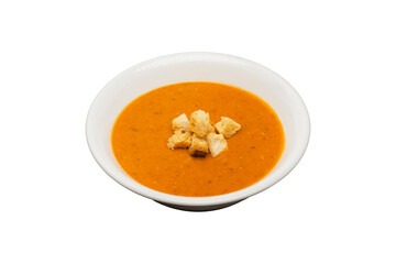 Ezogelin Soup from traditional Turkish cuisine isolated on a white background. Made with red lentils, bulgur and rice and served.