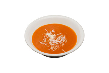 Tomato Soup from traditional Turkish cuisine is isolated on a white background. It is garnished with cheese and served.