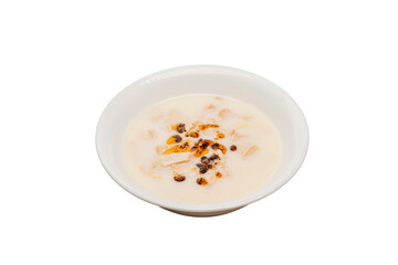 Tripe soup, typical of Turkish cuisine, is served in a bowl isolated on a white background.