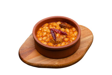 Dish of beans served in a clay pot isolated on a white background. A dish specific to Turkish cuisine.