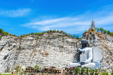 Big Lord Buddha Stone Mountain is landmark of Wat Khao Tham Thiam in province Suphanburi, Thailand. A place everyone in every religion can visit.