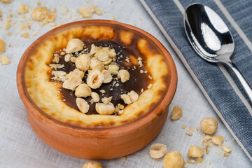 Sutlac Rice pudding. Oven baked rice pudding (sutlac), rice pudding in casserole with chopped hazelnuts. Sutlac Traditional Turkish dessert.