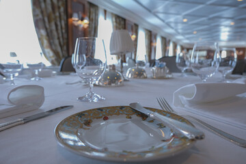 Formal and elegant ocean view dining room restaurant onboard luxury cruiseship or cruise ship liner...