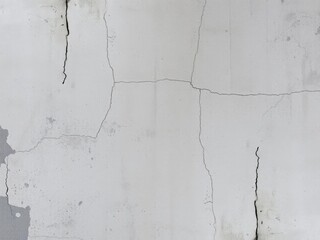 Obraz premium Gritty and weathered concrete wall background with stains and cracks, weathered