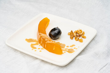 Turkish traditional pumpkin dessert(balkabagi tatlisi).Pumpkin dessert with syrup. Turkish and Middle Eastern cuisine desserts.