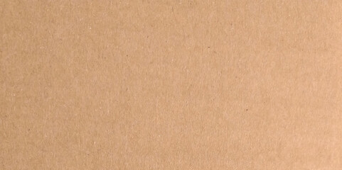 Fototapeta premium Craft brown paper texture surface macro close up view. Cardboard sheet texture background, detail of recycle brown paper box pattern.
