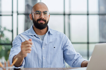 Businessman working on the table with laptop in a new office