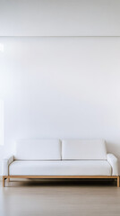 Minimalist white sofa in a modern living room with neutral decor and clean lines